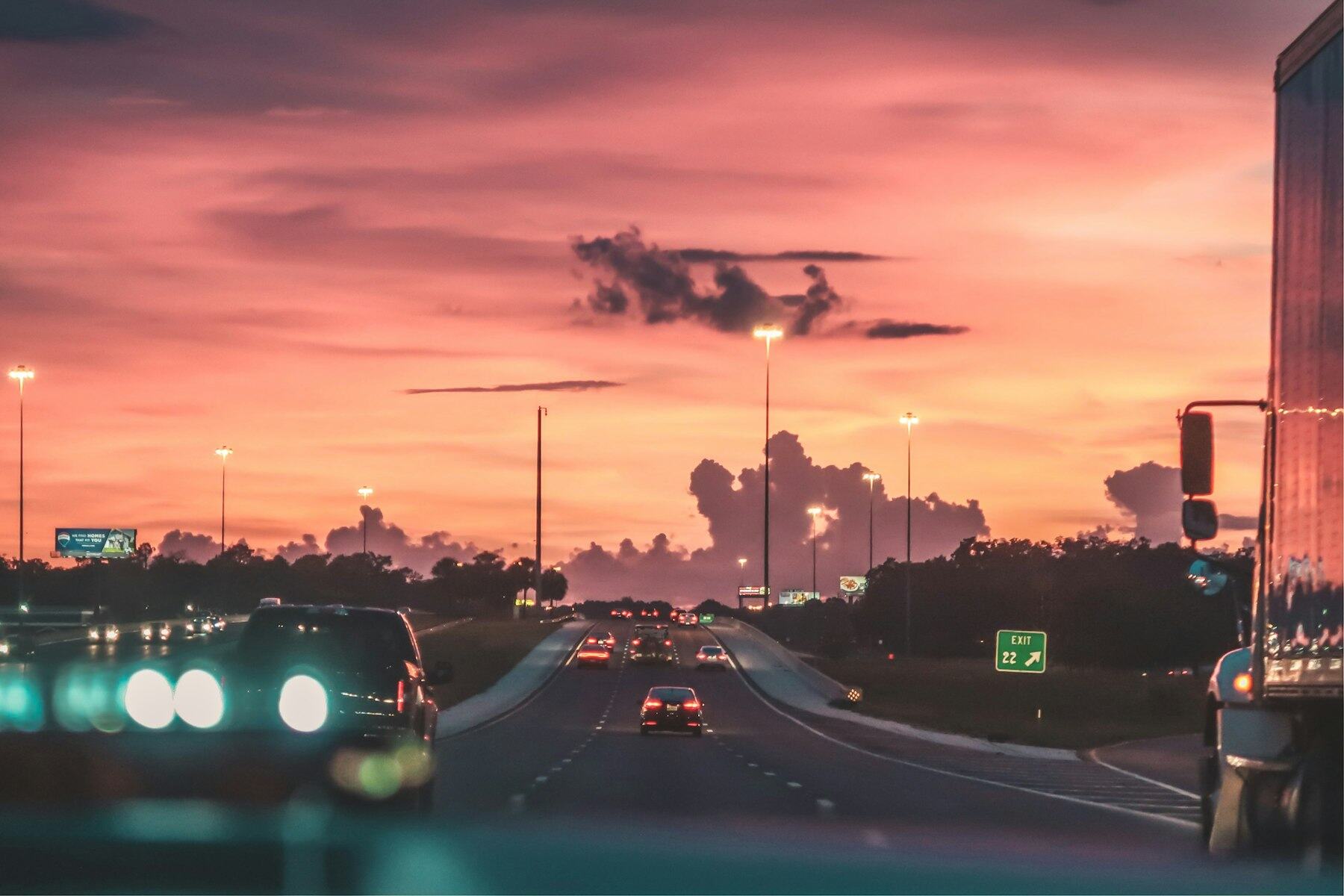 Tractor-trailer on an interstate at dusk