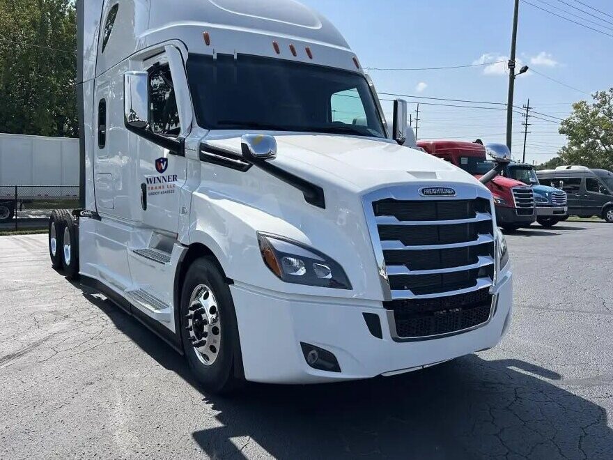 Winner Trans LLC Freightliner Cascadia sleeper tractor, front three-quarter view